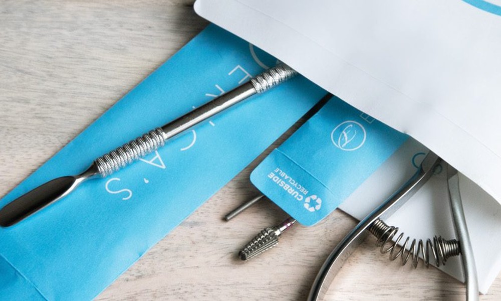 Erica's ATA luxury nail tool packaging, featuring the "curbside recyclable" messaging on their packaging.