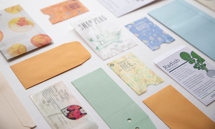 A variety of seed packets, both printed and blank copies.
