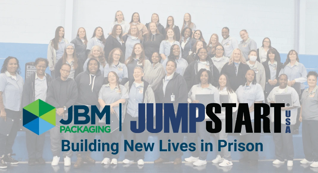 A group of women smiling; the details of their outfits suggest that they are wearing prison uniforms. The image is overlaid with the logos for JBM Packaging and Jumpstart USA as well as the text, "Building new lives in prison."